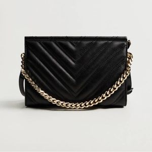 Faux leather cross body bag with chain detail from Mango